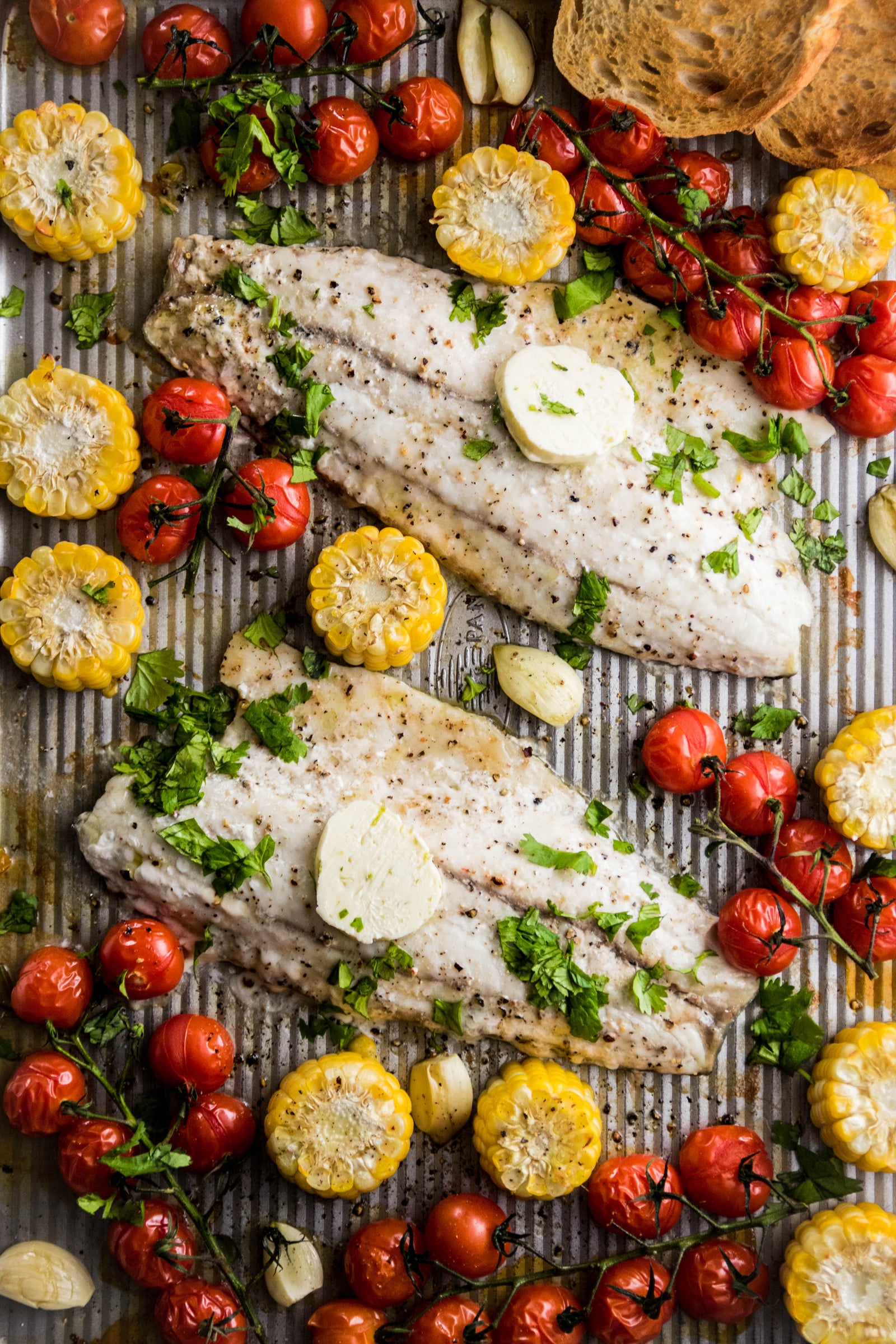 Sheet Pan Roasted Barramundi with Corn, Tomatoes, and Lime Butter