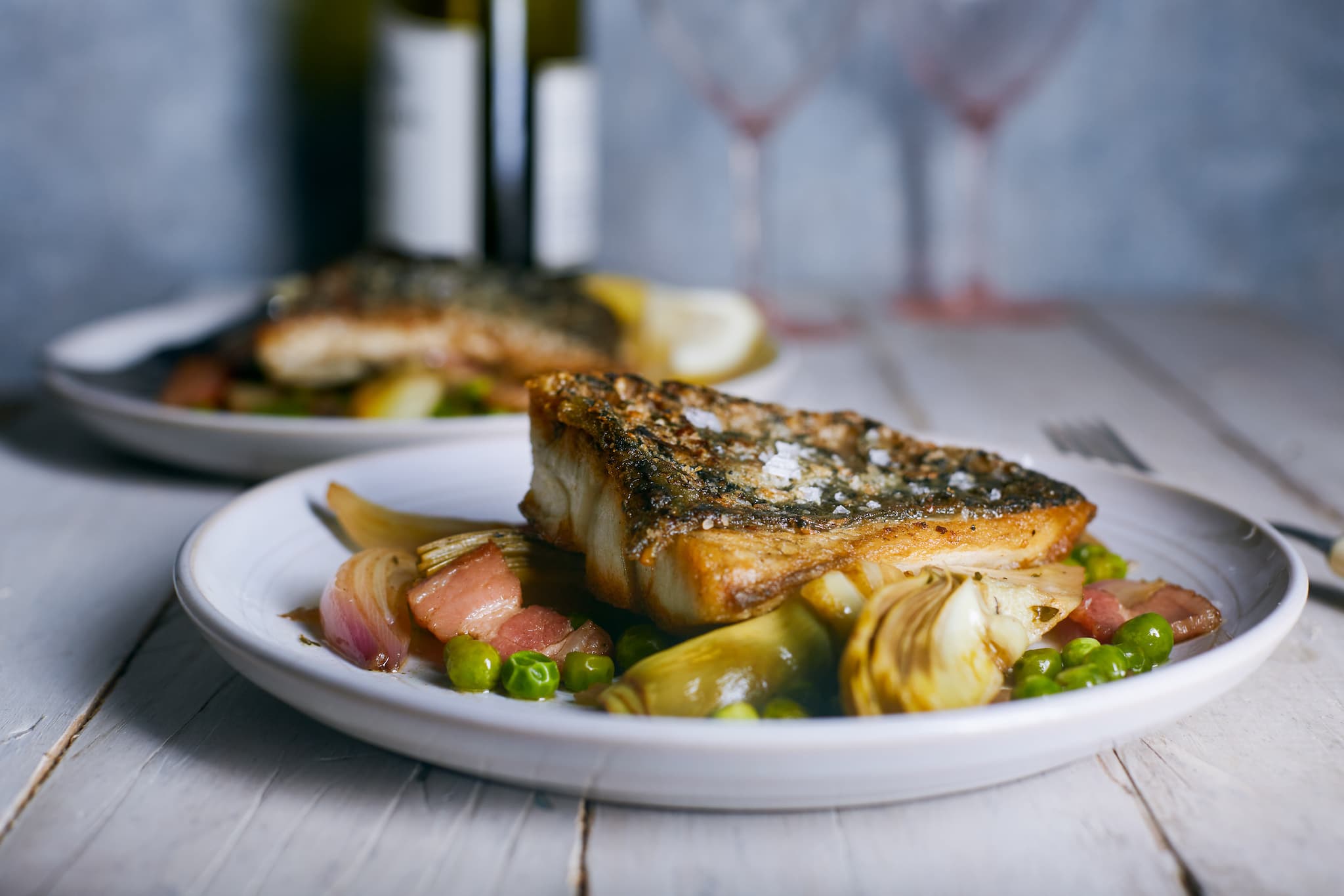 Barramundi with Braised Artichokes, Peas & Bacon | The Better Fish® Barramundi by Australis Aquacult